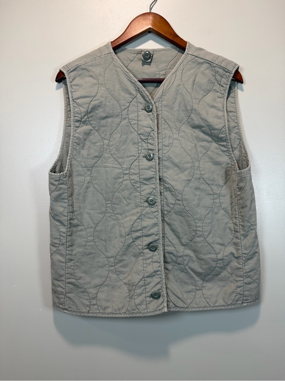 Women’s Quilted Sleeveless Cottage Core Vest in sage green.